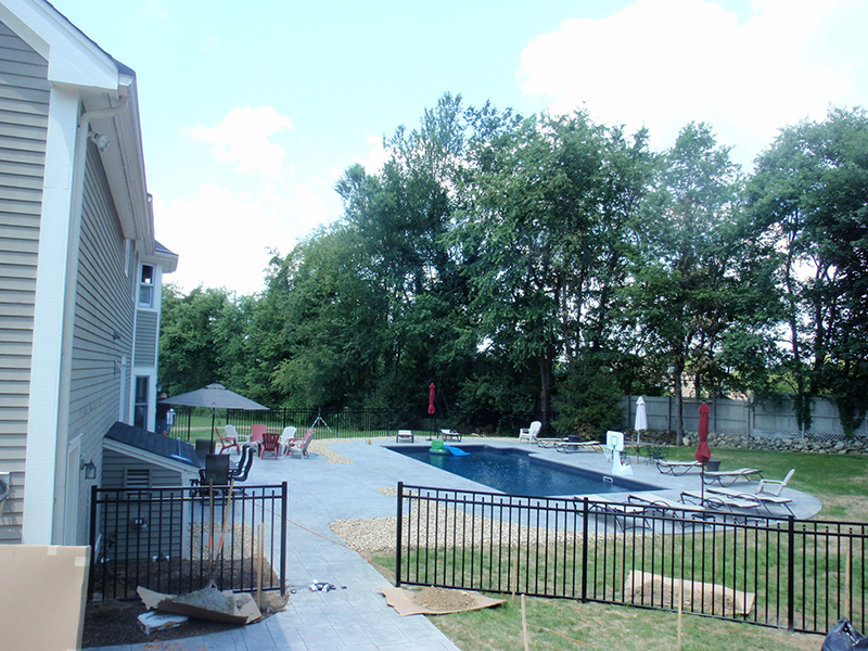Swimming pool and stamped concrete project example 14